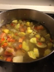 veg dumpling soup cooking